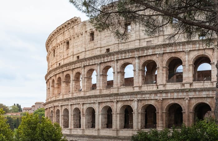 The Colosseum in Rome seen from street level — the world's largest ancient amphitheatre and the centrepiece of any private guided tour of Ancient Rome