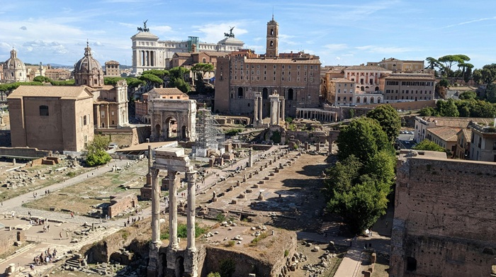 The Roman Forum with the Temple of Castor and Pollux in the foreground and the Altar of the Fatherland on the horizon — included in every private guided tour of Ancient Rome with the Colosseum 