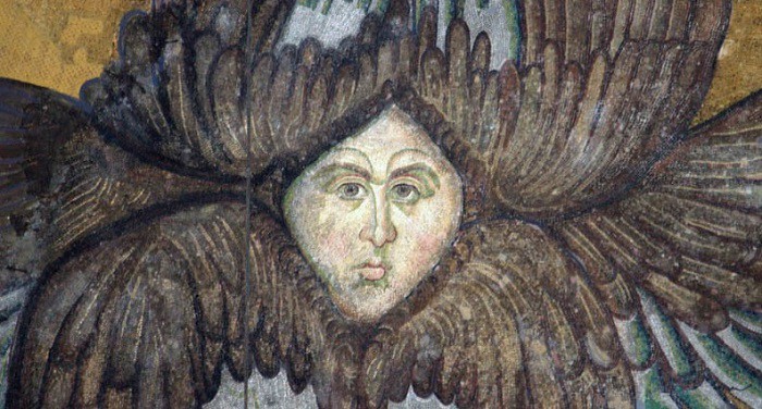 Close-up of a Byzantine mosaic seraph (six-winged angel) with a human face, located in the pendentives beneath the main dome of Hagia Sophia