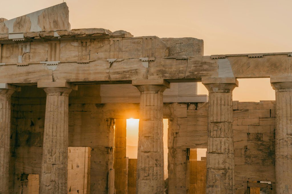 The Acropolis of Athens at sunset with the Parthenon and Athens city skyline in the background