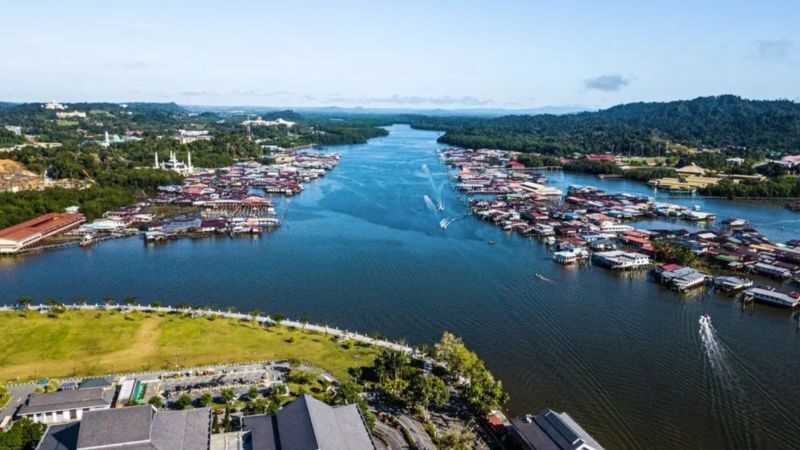 Wooden stilt houses of Kampong Ayer water village on the Brunei River during a private tour