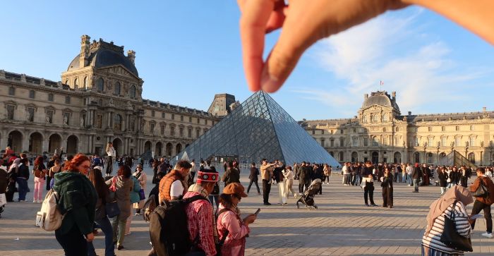 The glass pyramid entrance of the Louvre Museum, where the ticket office located.