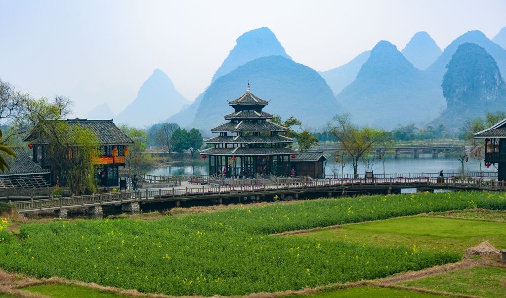 Traditional pavilion and karst peaks above the rice fields of the Guilin and Yangshuo countryside on a private guided tour