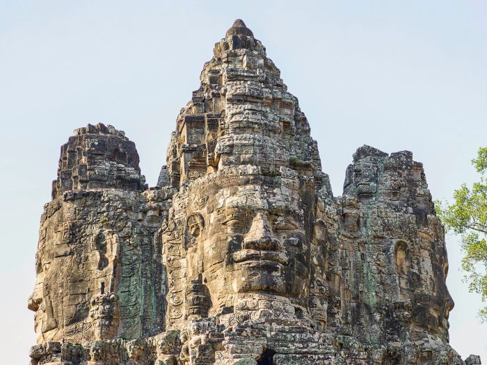 Carved stone faces on the towers of the Bayon temple at Angkor Thom, Siem Reap