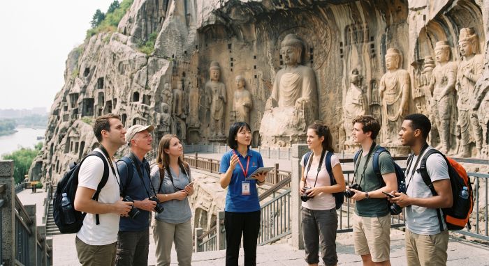 English speaking tour guide with a small group at the Fengxian Temple carvings, Longmen Grottoes, Luoyang