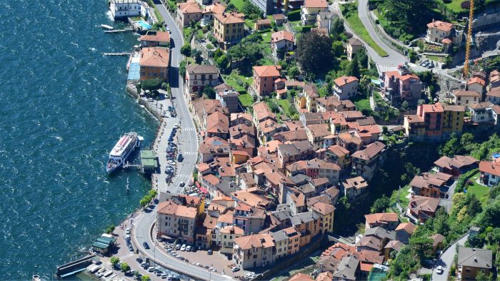 The fishing village of Peschiera Maraglio on Monte Isola seen from the ferry crossing Lake Iseo
