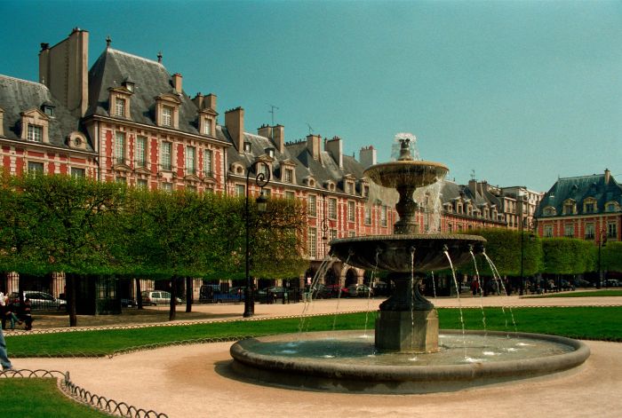 Arcaded brick houses around the Place des Vosges in the Marais district of Paris
