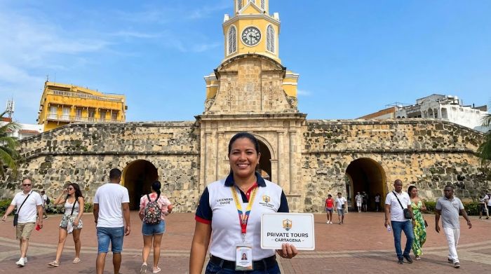 Licensed private tour guide at the Clock Tower gate of the Walled City in Cartagena, Colombia (ai illustrated)